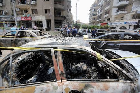 A car damaged as a result of a car bomb attack on the convoy of Egyptian public prosecutor Hisham Barakat near his house at Heliopolis district, is seen in Cairo, June 29, 2015. REUTERS/Mohamed Abd El Ghany