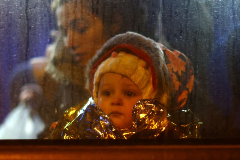 People fleeing Russia's invasion of Ukraine arrive at the border checkpoint in Medyka