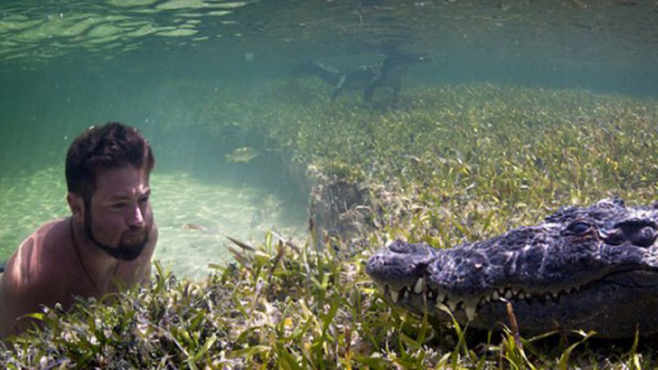 One man was seen inspecting the croc's in nothing but his bathers. Photo: M Romanov