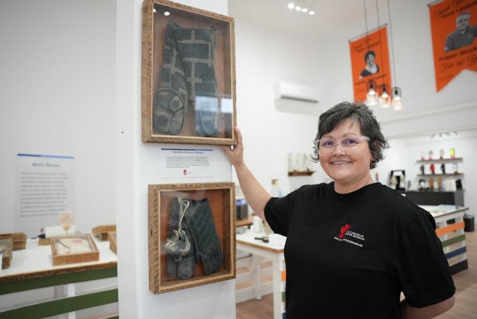 Tammy Fudge works in the research department for the Superior Gloves company in Point Leamington and says she is excited about acquiring more historical gloves for the museum. (Melissa Tobin/CBC - image credit)