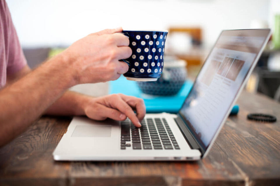 A computer user with a coffee mug. Source: Getty Images