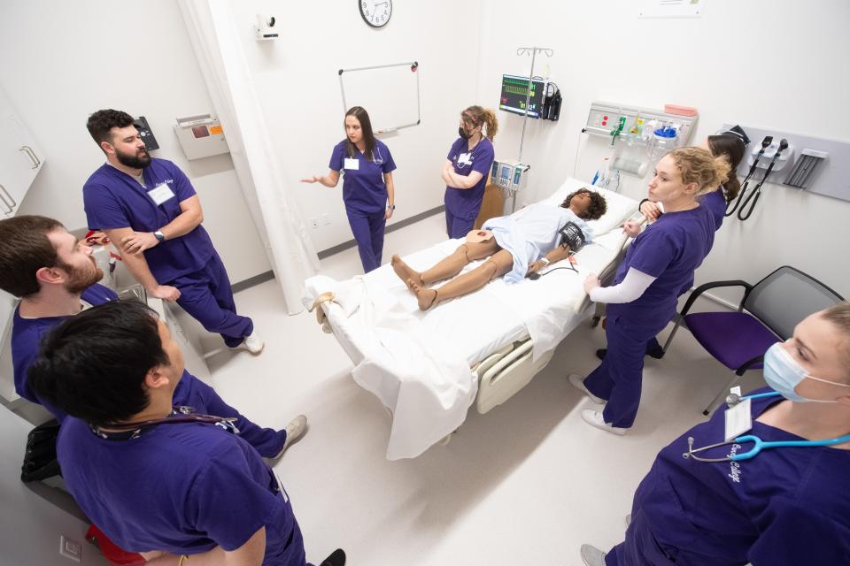 Nursing students and faculty demonstrate some of the capabilities of Curry College's new nursing simulation lab and training center at the school's Plymouth campus.