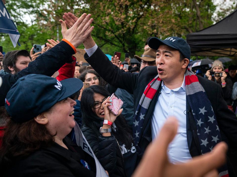 Democratic presidential candidate Andrew Yang greets supporters before taking the stage during a rally in Washington Square Park, May 14, 2019 in New York City. One of Yangs major campaign promises is a universal basic income of $1,000 every month for every American 18 years and older.