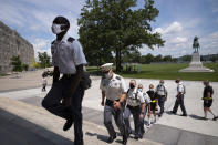 A formation of new cadets marches in formation, Monday, July 13, 2020, at the U.S. Military Academy in West Point, N.Y. The Army is welcoming more than 1,200 candidates from every state. Candidates will be COVID-19 tested immediately upon arrival, wear masks, and practice social distancing. (AP Photo/Mark Lennihan)