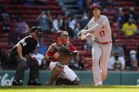 Los Angeles Angels' Shohei Ohtani (17) strikes out swinging in front of Boston Red Sox catcher Christian Vazquez, center, during the third inning of a baseball game, Saturday, May 15, 2021, in Boston. (AP Photo/Michael Dwyer)