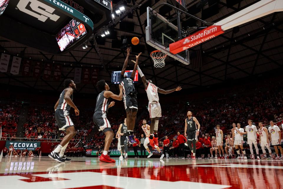 Washington State Cougars center Rueben Chinyelu (20) and Utah Utes center Keba Keita (13) jump up for a rebound during a men’s college basketball game between the University of Utah and Washington State University at the Jon M. Huntsman Center in Salt Lake City on Friday, Dec. 29, 2023. | Megan Nielsen, Deseret News