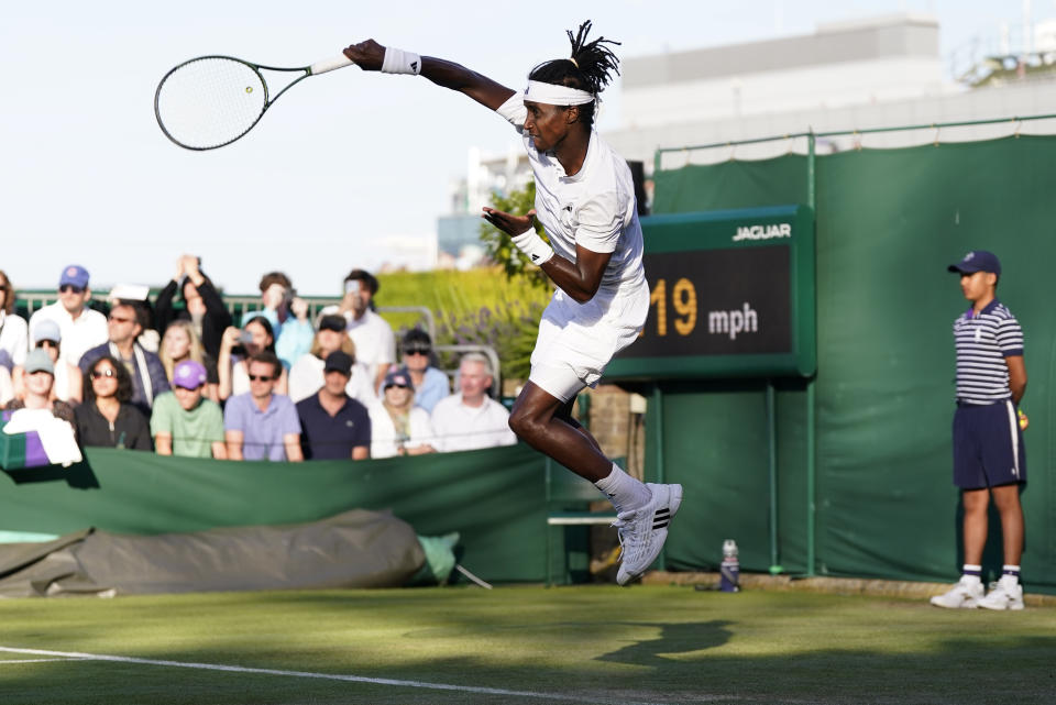 Sweden's Mikael Ymer serves to Taylor Fritz of the US in a men's singles match on day four of the Wimbledon tennis championships in London, Thursday, July 6, 2023. (AP Photo/Alberto Pezzali)