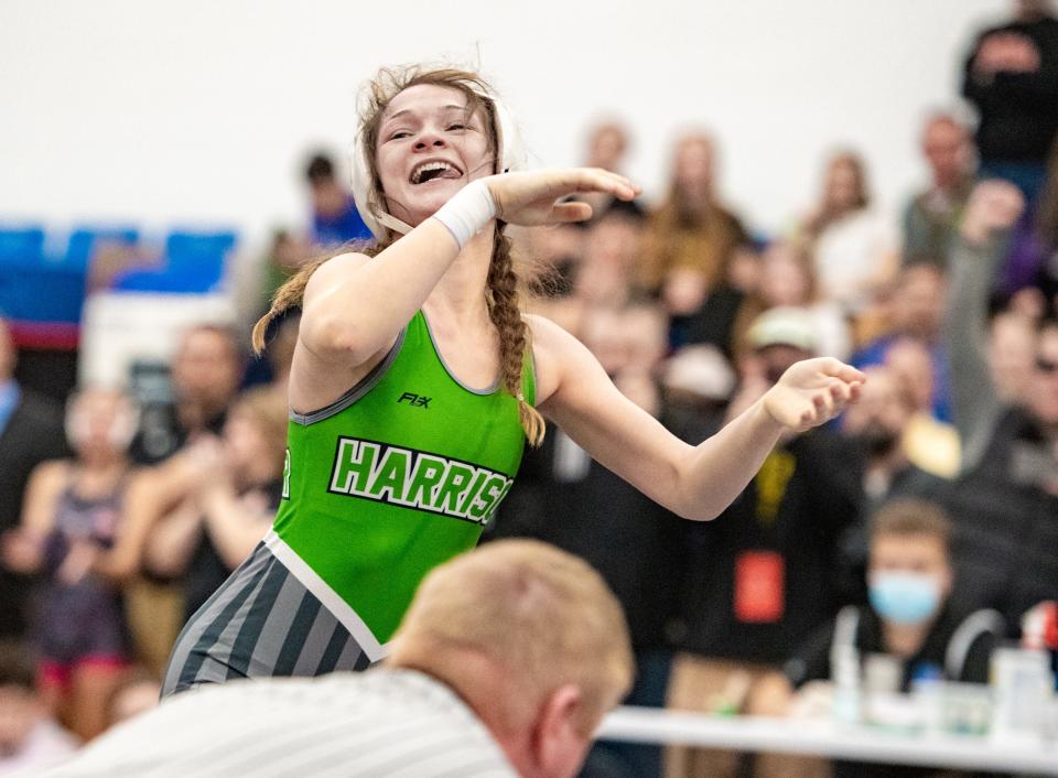 Harrison’s Chloe Dearwester looks to the stands as she defeats Chelsea Horsley of Bellefontaine to win the 105-pound state championship Feb. 20, 2022, at Hilliard Davidson.