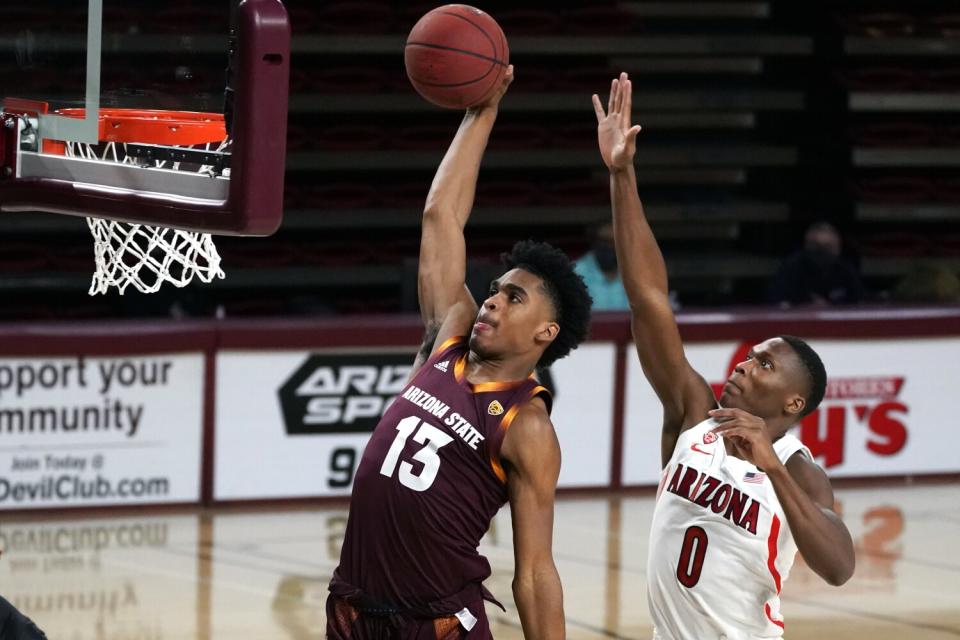 Arizona State guard Josh Christopher dunks in front of Arizona guard Bennedict Mathurin.