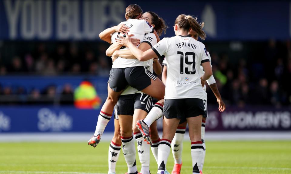 <span>Manchester United players celebrate Grace Clinton’s strike, the only goal of the game.</span><span>Photograph: Charlotte Tattersall/MUFC/Manchester United/Getty Images</span>