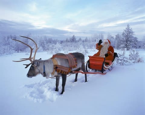 Father Christmas in Rovaniemi, Finnish Lapland - Credit: 2009 AFP/MARTTI KAINULAINEN