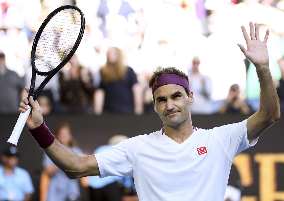 Switzerland's Roger Federer reacts after defeating Tennys Sandgren of the U.S. in their quarterfinal match at the Australian Open tennis championship in Melbourne, Australia, Tuesday, Jan. 28, 2020. (AP Photo/Andy Brownbill)