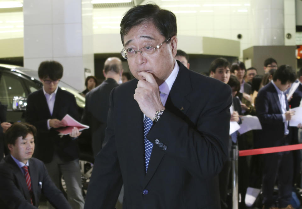 In this Monday, Nov. 26, 2018, file photo, Mitsubishi Motors Corp. Chairman Osamu Masuko leaves after the press conference at the headquarters of the automaker in Tokyo. The board of Japanese automaker Mitsubishi Motors, which is allied with Renault and Nissan, met Monday to decide whether to keep or oust Carlos Ghosn as its chairman after his arrest last week. (AP Photo/Koji Sasahara, File)