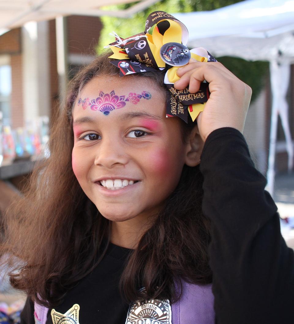 Leah Hammonds picks out the Nightmare Before Christmas bow for her hair at the 2020 Main Street Festival in Gallatin.
