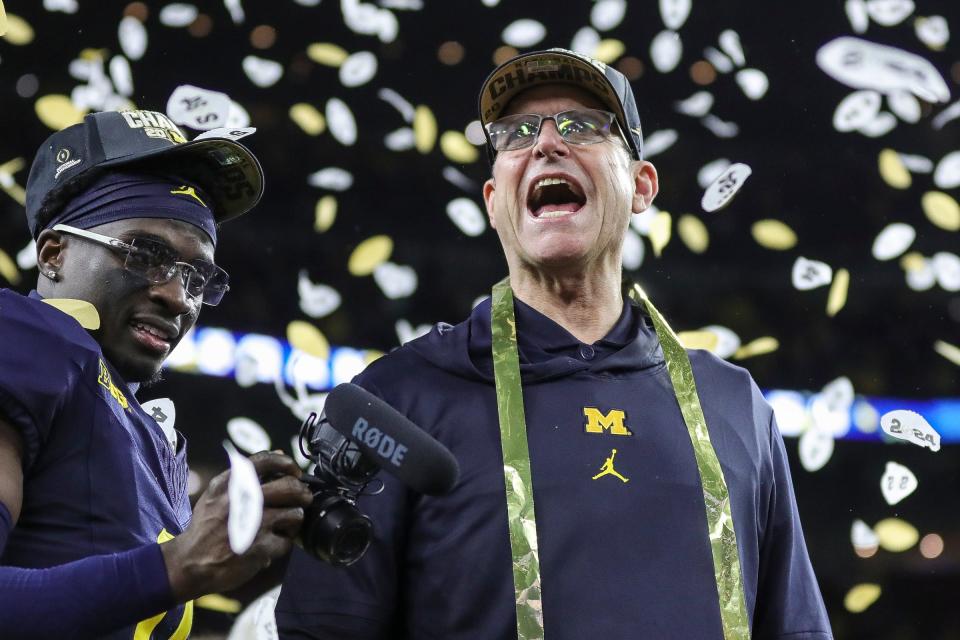 Michigan head coach Jim Harbaugh celebrates during the trophy presentation after the 34-13 win over Washington at the national championship game at NRG Stadium in Houston on Monday, Jan. 8, 2024.