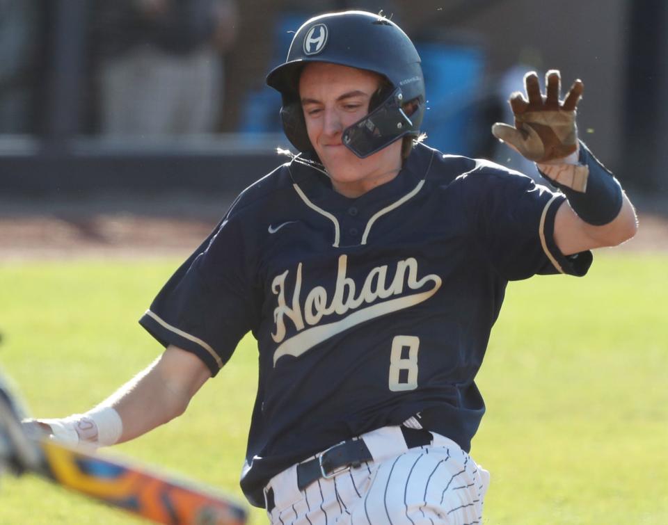 Hoban baserunner Will Givens scores against St. Vincent-St. Mary in the first inning, Friday, May 10, 2024, at Canal Park.