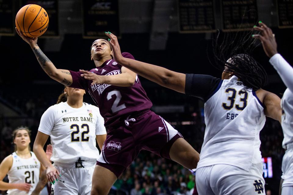 Mississippi State's JerKaila Jordan (2) drives past Notre Dame's Lauren Ebo (33) during the first half of a second-round college basketball game in the women's NCAA Tournament, Sunday, March 19, 2023, in South Bend, Ind. (AP Photo/Michael Caterina)