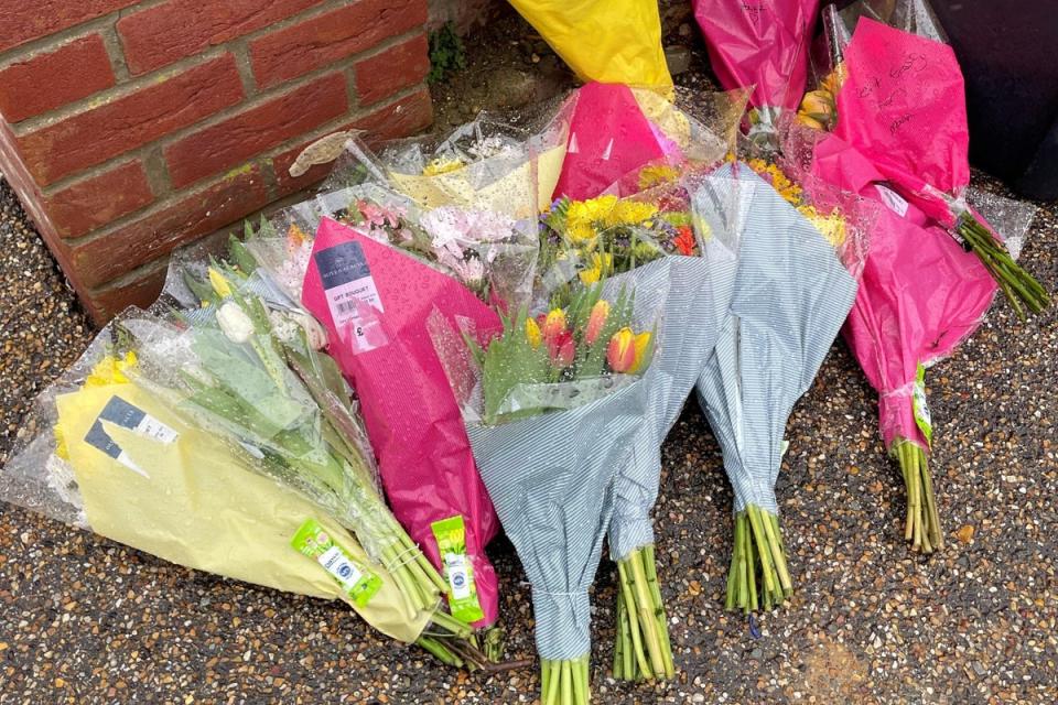Floral tributes outside the home of Gary Dunmore, 57, who was shot dead in Sutton (PA)