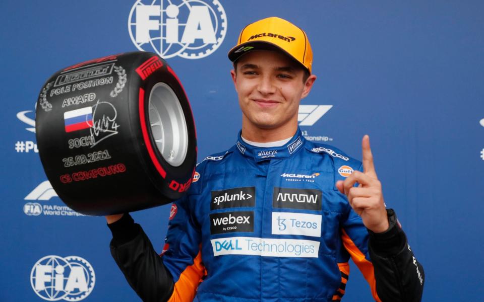 Formula One F1 - Russian Grand Prix - Sochi Autodrom, Sochi, Russia - September 25, 2021 McLaren's Lando Norris celebrates pole position after qualifying  - Pool via REUTERS/Yuri Kochetkov