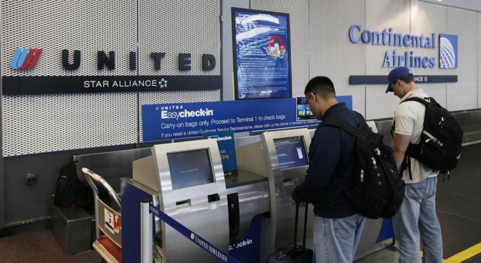 FILE - In this May 3, 2010 file photo, passengers check-in for their flight in Chicago's O'Hare International Airport. A bipartisan group of 33 lawmakers led by House Transportation and Infrastructure Committee Chairman Bill Shuster, R-Pa., is backing a bill that would allow airlines to return to their old way of doing things, which is to emphasize in ads the base airfare, the amount airlines charge passengers to fly, and reveal the full price including taxes and fees separately. (AP Photo/Charles Rex Arbogast)