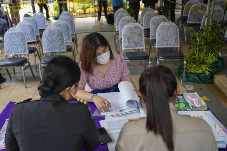 Potential candidates to become members of Thailand's next Senate arrive at the Phaya Thai district office in Bangkok on Monday, May 20, 2024. Thailand on Monday officially kicked off the task of selecting a new set of Senators, a process that has become part of the ongoing war between progressive forces hoping for democratic political reforms and conservatives seeking to keep the status quo.(AP Photo/Sakchai Lalit)