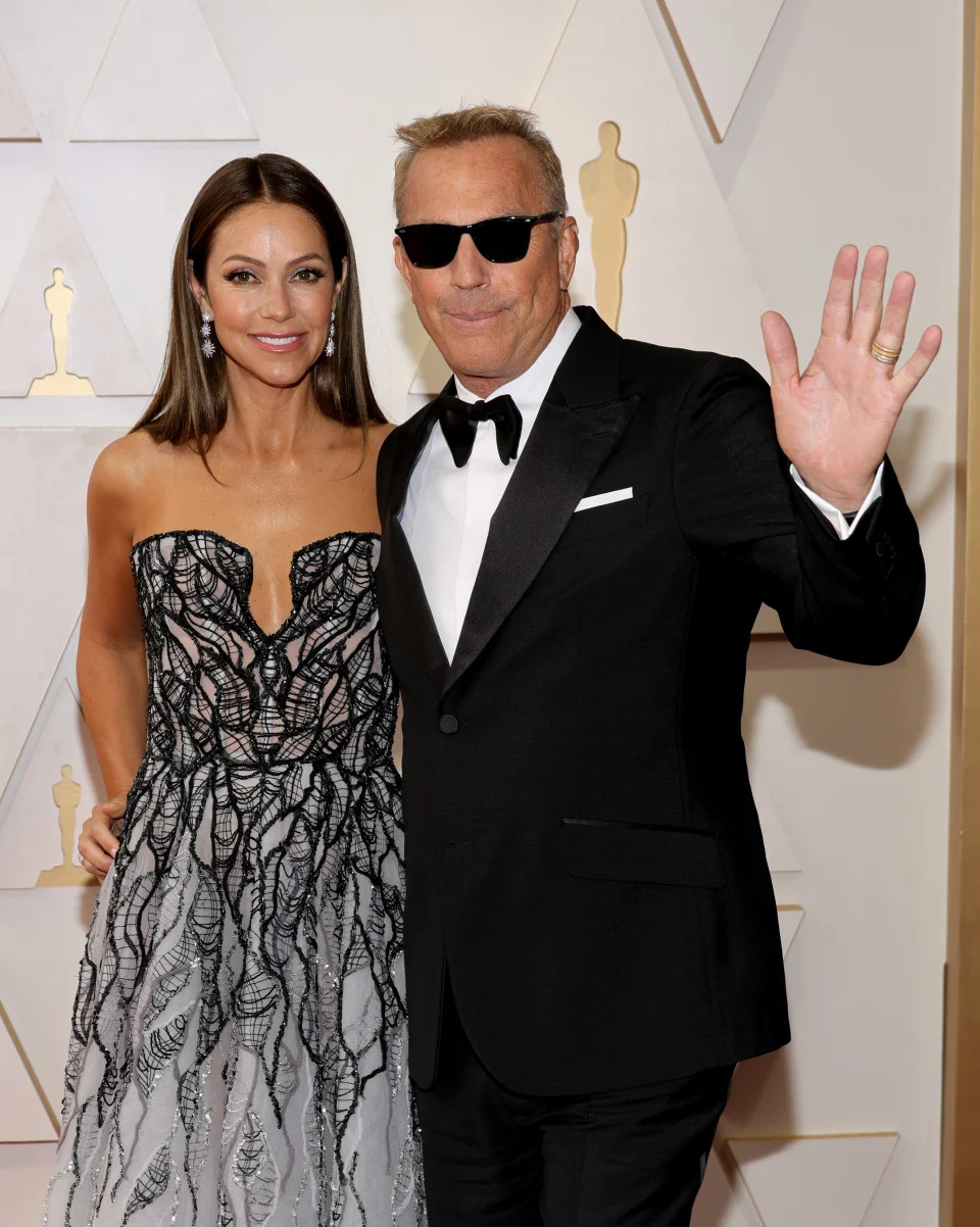 HOLLYWOOD, CALIFORNIA - MARCH 27: (L-R) Christine Baumgartner and Kevin Costner attend the 94th Annual Academy Awards at Hollywood and Highland on March 27, 2022 in Hollywood, California. (Photo by Mike Coppola/Getty Images)