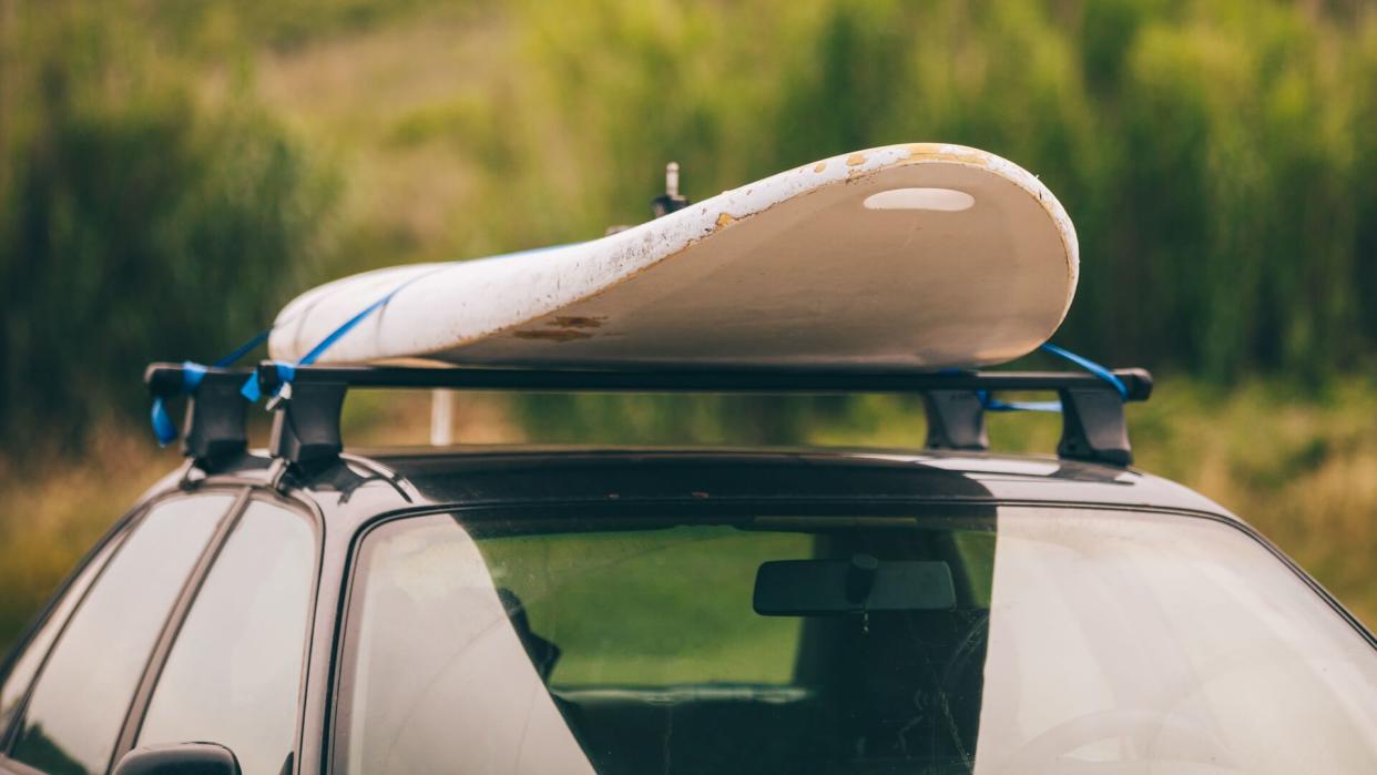 Windsurfing board on the top of the car.