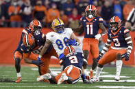 Pittsburgh tight end Gavin Bartholomew (86) makes a catch among several Syracuse defenders during the first half of an NCAA college football game in Syracuse, N.Y., Saturday, Nov. 27, 2021. (AP Photo/Adrian Kraus)