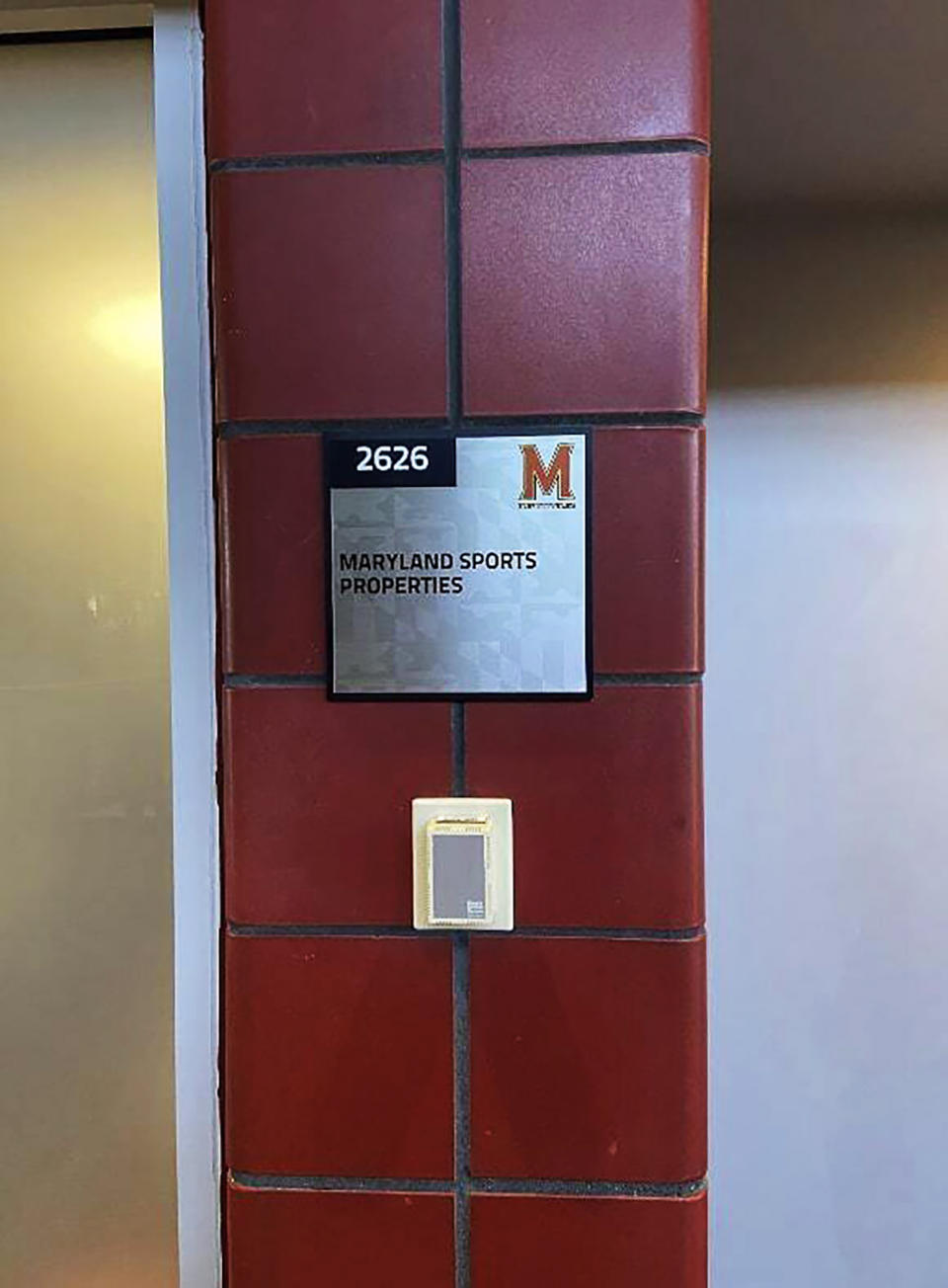 In this Oct. 10, 2022, photo provided by the Shirley Povich Center for Sports Journalism, the door to Maryland Sports Properties, a private company created by sports marketing firm Playfly, looks identical to the doors of other university office spaces in the University of Maryland's Xfinity Center in College Park, Md. Playfly facilitated Maryland's partnership with PointsBet. (Kevin McNulty/Shirley Povich Center for Sports Journalism via AP)