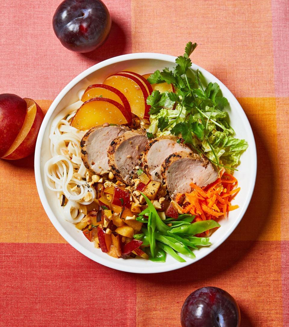 Stir together a dressing of soy, rice vinegar, and ginger, then put it to work two ways: Use a portion as the starter for the pork marinade and the rest for a plum relish on this fresh noodle bowl.