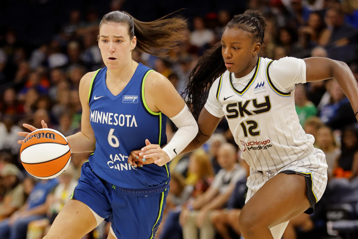 Minnesota Lynx forward Bridget Carleton (6) works past Chicago Sky forward Michaela Onyenwere (12) in the second quarter of a WNBA basketball game Friday, Sept. 13, 2024, in Minneapolis. (AP Photo/Bruce Kluckhohn)