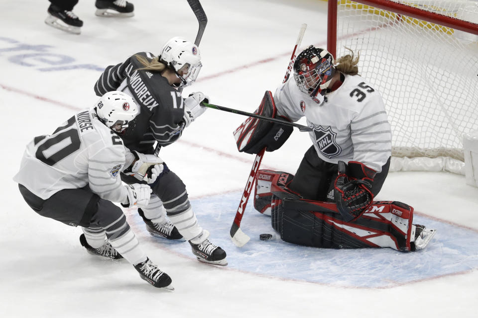 FILE - Canada goalie Ann-Renee Desbiens (35) stops a United States' J. Lamoureux-Davidson (17) shot as Sarah Nurse (20) defends during the first period in the women's 3-on-3 game, part of the NHL hockey All-Star weekend, Friday, Jan. 24, 2020, in St. Louis. NHL officials are assisting the PWHL on scheduling and other startup logistics to try to assist with the short timeline before the first season. (AP Photo/Jeff Roberson, File)