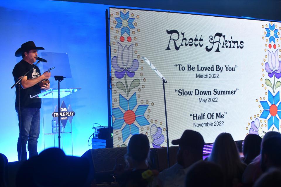 Rhett Akins speaks during the  CMA Triple Play Awards March 1 in Nashville.