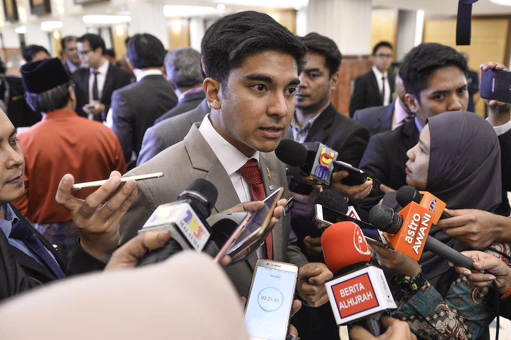 Syed Saddiq Abdul Rahman speaks to reporters in Parliament after the tabling of Budget 2020 on October 11, 2019. — Picture by Miera Zulyana