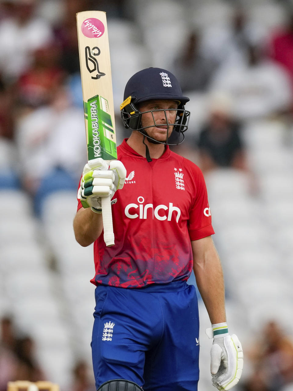 England's captain Jos Buttler acknowledges scoring fifty runs against West Indies during the fourth T20 cricket match at Brian Lara Stadium in Tarouba, Trinidad and Tobago, Tuesday, Dec. 19, 2023. (AP Photo/Ricardo Mazalan)