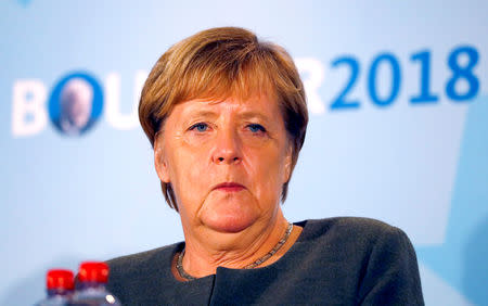 FILE PHOTO: German Chancellor Angela Merkel supports her Christian Democratic Union (CDU) party colleague and Hesse State Prime Minister Volker Bouffier during an election campaign rally for the upcoming state election in Ortenberg, Germany, October 22, 2018. REUTERS/Kai Pfaffenbach