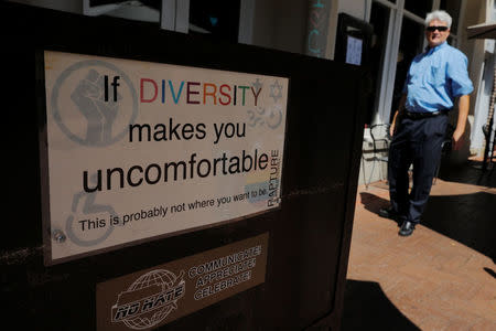 A sign supporting diversity stands outside the Rapture Restaurant, ahead the one-year anniversary of the fatal white-nationalist rally, in Charlottesville, Virginia, U.S., August 1, 2018. REUTERS/Brian Snyder