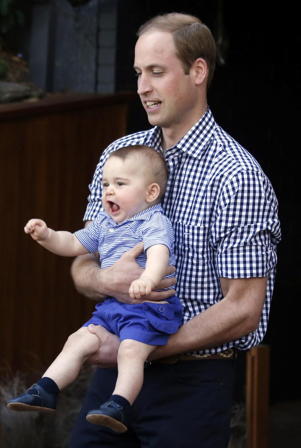 Britain's Prince William holds his son Prince George during a visit to Sydney's Taronga Zoo, Australia Sunday, April 20, 2014. (AP Photo/David Gray, Pool)