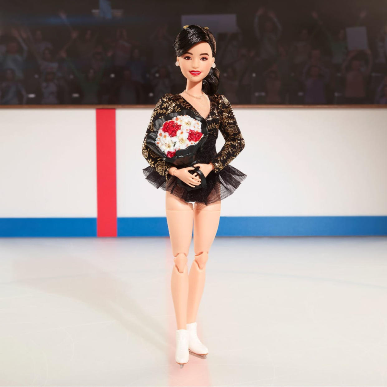 The Barbie doll sparkles in a black leotard with shimmering golden accents in a reproduction of the costume she wore when she won gold at the 1992 Winter Games, designed by Lauren Sheehan. (Mattel)