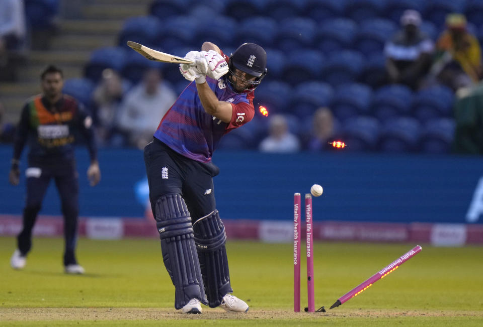 England's Dawid Malan, is clean bowled bu Sri Lanka's Isuru Udana, during the T20 international cricket match between England and Sri Lanka at Cardiff, Wales, Wednesday, June 23, 2021. (AP Photo/Alastair Grant)