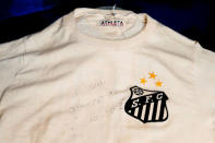 An autographed shirt wore by Pele during a match between Santos and Chelsea in 1971 is displayed by Julien's Auctions in New York City, U.S., December 1, 2016. REUTERS/Brendan McDermid