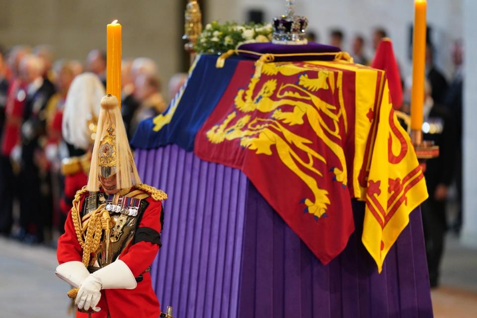 Four officers from the Household Cavalry guard the Queen’s coffin in 2022 (PA Wire)