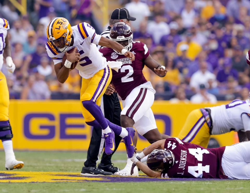 Sep 17, 2022; Baton Rouge, Louisiana, USA;  Mississippi State Bulldogs linebacker Jett Johnson (44) tackles LSU Tigers quarterback Jayden Daniels (5) during the first half at Tiger Stadium. Mandatory Credit: Stephen Lew-USA TODAY Sports