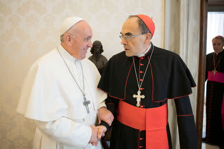 FILE PHOTO: Pope Francis receives Cardinal Philippe Barbarin, Archbishop of Lyon, at the Vatican, March 18, 2019. Vatican Media/Handout via REUTERS