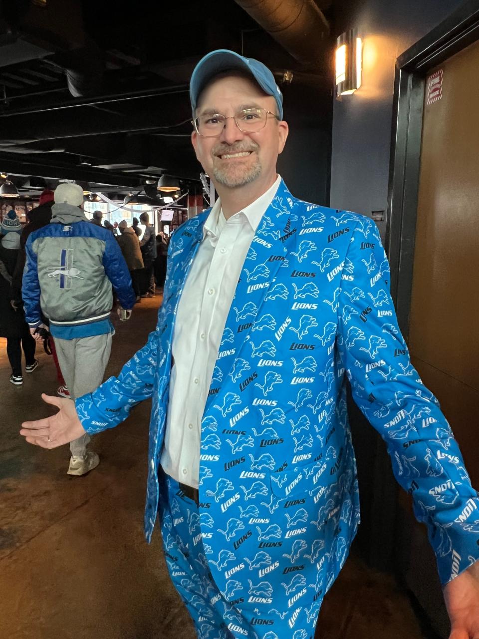 David Hauer, of Cleveland, poses for a photo at a fan event inside Comerica Park on Sunday, Jan. 21, 2024, before the Detroit Lions face the Tampa Bay Buccaneers. Hauer, who grew up in Eastpointe, said he was feeling a bit nervous ahead of kickoff, but thought the Lions would pull through.