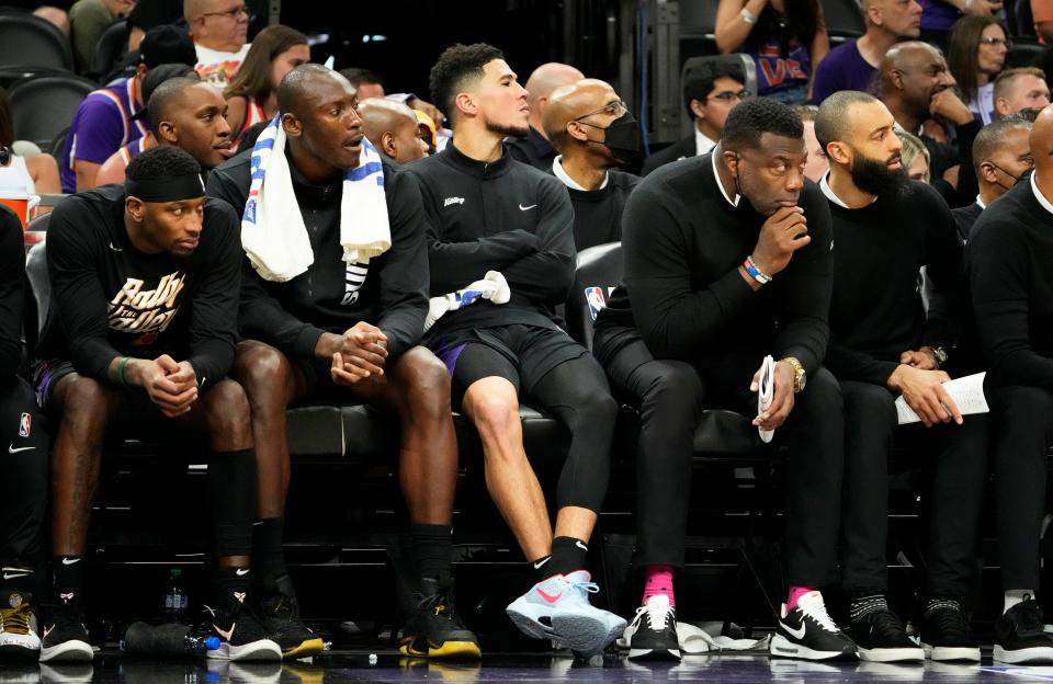 May 15, 2022; Phoenix, Arizona, USA; Phoenix Suns guard Devin Booker (1) watches the game from the bench in the fourth quarter against the Dallas Mavericks during game seven of the second round for the 2022 NBA playoffs at Footprint Center.