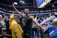 New Orleans Pelicans guard Trey Murphy III (25) celebrates with fans as he leaves the court following the team's win over the Los Angeles Clippers in an NBA basketball game Friday, March 15, 2024, in New Orleans. (AP Photo/Matthew Hinton)