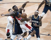 Washington Wizards guard Bradley Beal (3) is fouled as he shoots by New Orleans Pelicans forward Zion Williamson (1) in the second quarter of an NBA basketball game in New Orleans, Wednesday, Jan. 27, 2021. (AP Photo/Derick Hingle)