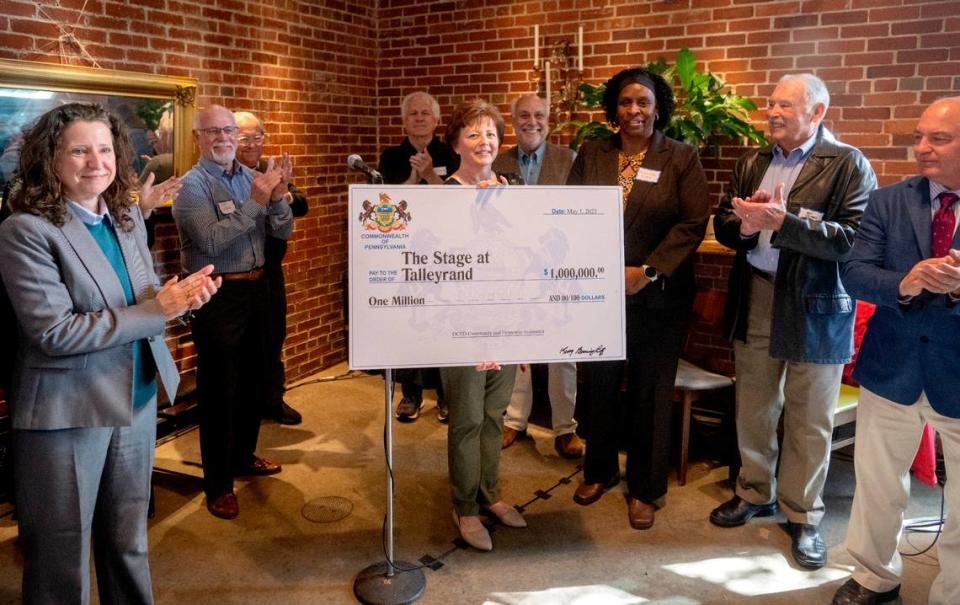 The Stage Talleyrand development committee receives a check for $1 million during an event on Monday, May 1, 2023.