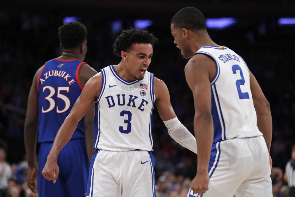 Duke guard Tre Jones (3) and guard Cassius Stanley (2) react after a basket during the second half of the team's NCAA college basketball game against Kansas on Tuesday, Nov. 5, 2019, in New York. (AP Photo/Adam Hunger)